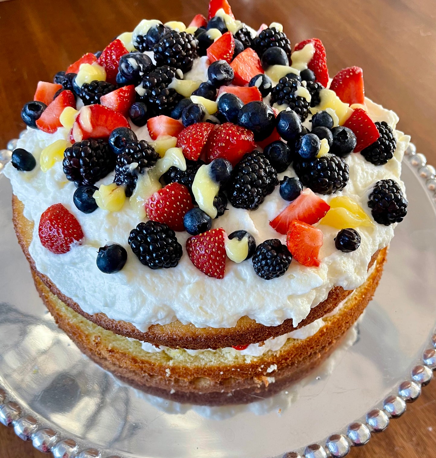 Citrus, Cream, and Berry Cake image 0